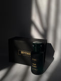 Black bottle labeled 'Mythic' with a matching box on a dark background