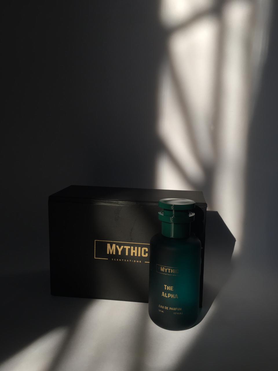 Bottle of 'The Alpha' by Mythic on a dark surface with a black box in the background.