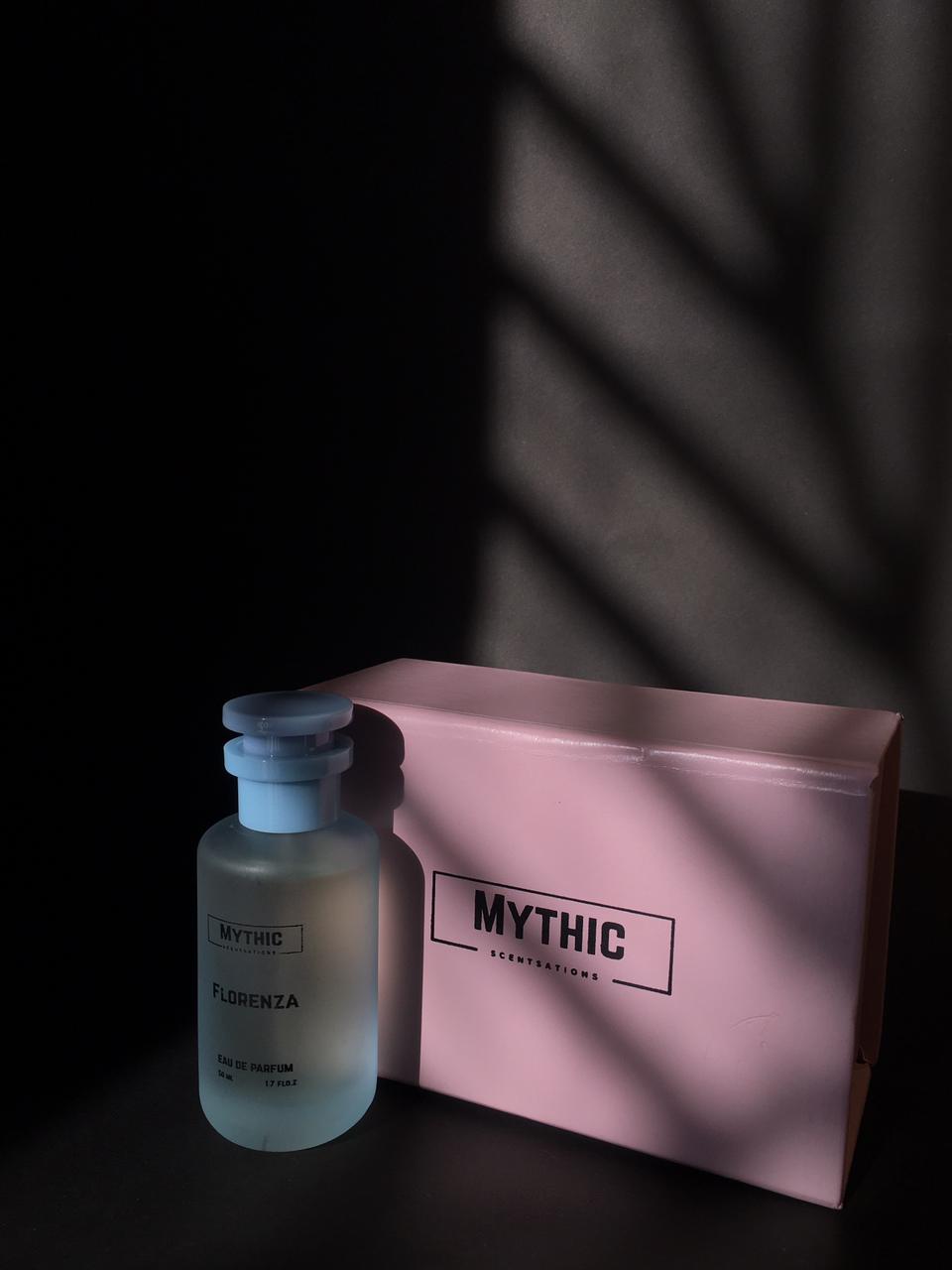 Mythic bottle and pink pouch on a dark background